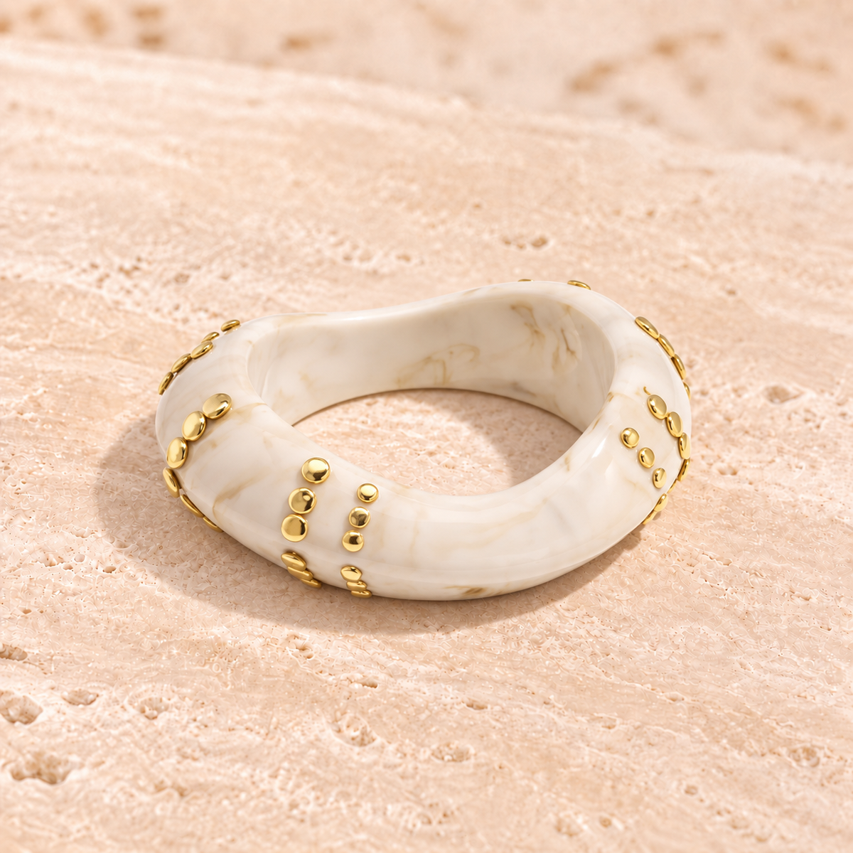 Marbelune bangle bracelet with studs in a striped pattern