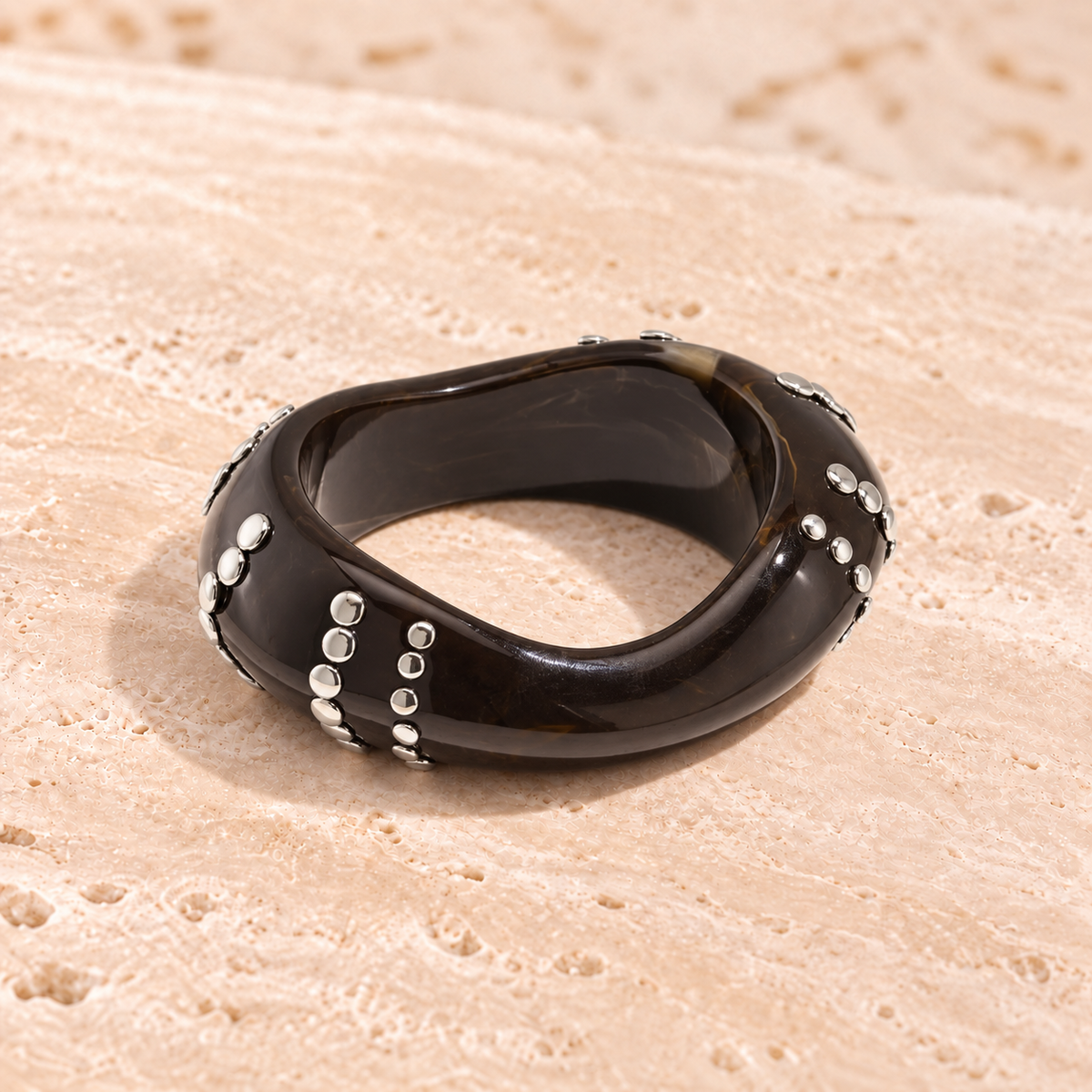 Marbelune bangle bracelet with studs in a striped pattern
