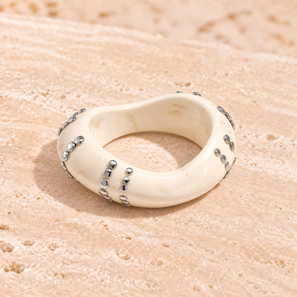 Marbelune bangle bracelet with studs in a striped pattern
